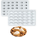 White 30-cavity silicone baking mold for making almond-shaped chocolates, candies and mini desserts.