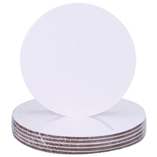Stack of 6-inch round white greaseproof cake boards with smooth edges and kraft backing for cake display and support.
