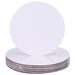 Stack of 6-inch round white greaseproof cake boards with smooth edges and kraft backing for cake display and support.
