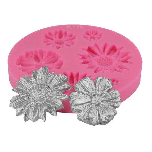 Pink assorted daisy silicone mold for creating fondant flowers, gum paste decorations, chocolates, candies, cupcake toppers, and cake decorations.