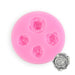Pink silicone fondant mold with four assorted rose flower cavities for creating detailed edible floral decorations from fondant, gum paste, chocolate, candy, and cake decorating materials.