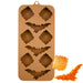 Brown silicone mold featuring bat and spider web cavities for making Halloween chocolates, candies, fondant decorations, and themed treats.