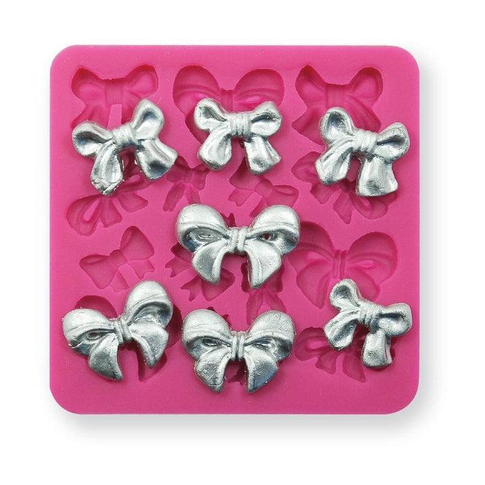 Bow silicone fondant mold with multiple bow cavities for creating detailed cake, cupcake, cookie, chocolate, and fondant decorations