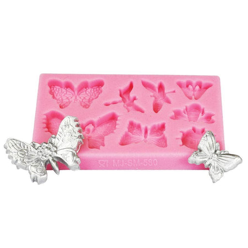 Pink butterfly and dragonfly silicone fondant mold for creating detailed cake decorations, cupcake toppers, chocolate accents, and edible dessert embellishments.