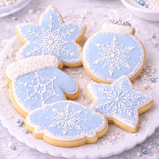 Christmas cookies decorated with Mini Jeweled Snowflake stencil designs