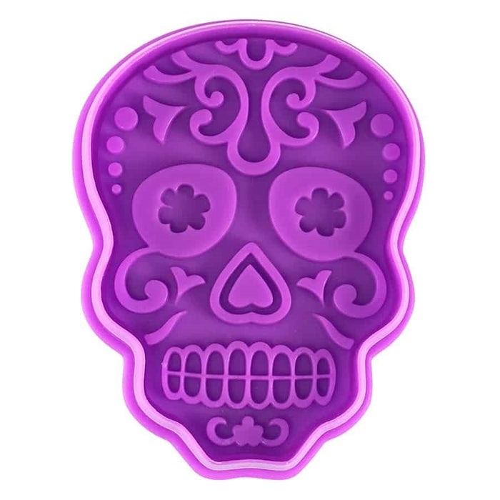 Purple Day of the Dead sugar skull cookie cutter and stamper with detailed floral skull design.