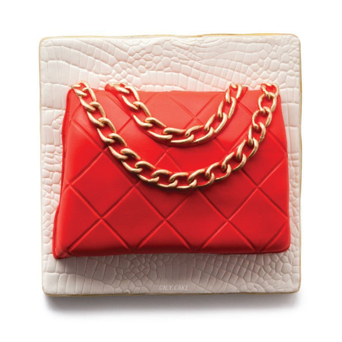 Finished red designer handbag cake made with purse foam dummy