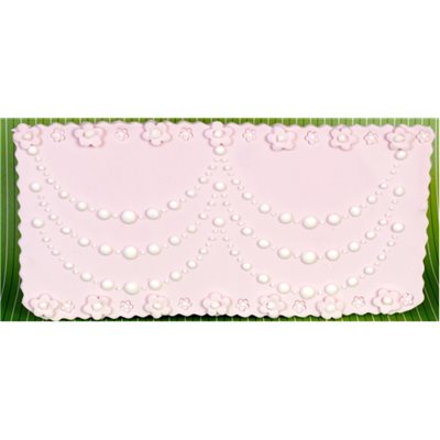 Pink cake decorated with elegant pearl draping stencil pattern