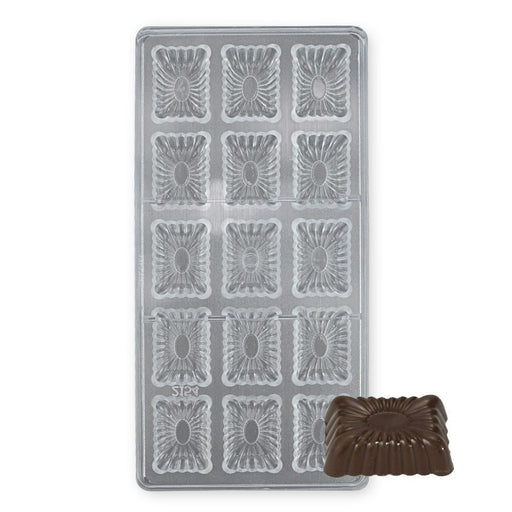 Chocolate mold cavities showing detailed fluted pattern