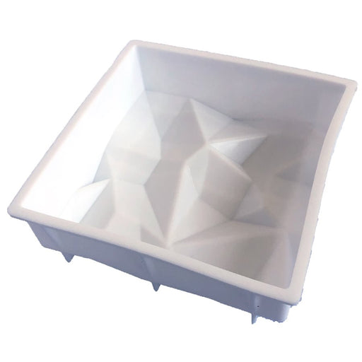 7-inch geometric silicone baking and freezing mold with dimensional faceted design for cakes and desserts.