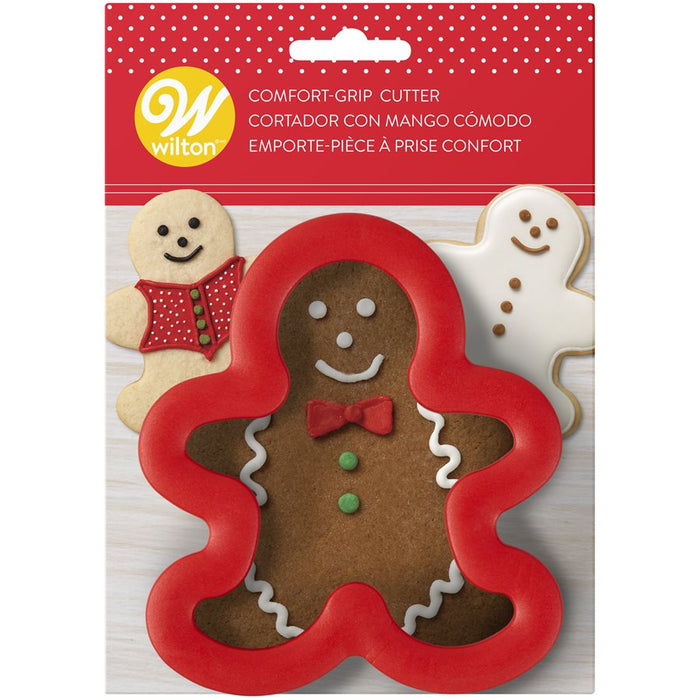 Wilton Gingerbread Man Comfort Grip Cookie Cutter 3 inch red plastic cutter with gingerbread cookie decorating examples on packaging