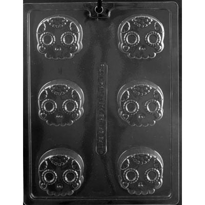 6-cavity plastic decorative skull mold for making chocolate, candy, fondant and Halloween treats.