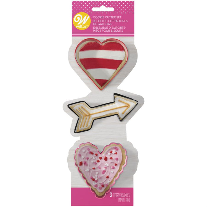 Wilton 3-piece Valentine's Day cookie cutter set featuring heart, Cupid's arrow and scalloped heart metal cutters in original packaging