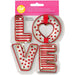 Wilton LOVE Cookie Cutter Set with four metal letter-shaped cutters spelling LOVE in original pink Valentine's Day packaging