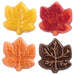 Maple leaf chocolate candy decorations in yellow, red, orange and brown made with Wilton maple leaf candy mold