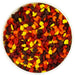 Mini fall leaves edible sprinkles in red, orange, yellow and brown for decorating Thanksgiving cakes, cupcakes, cookies and other desserts.