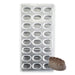 Polycarbonate chocolate mold featuring 24 oval leaf-pattern cavities for creating glossy artisan chocolates, bonbons, and truffles.
