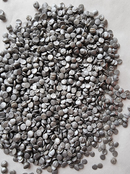Pearlized silver sequin-shaped edible sprinkles for decorating cakes, cupcakes, cookies, chocolates, and special occasion desserts.