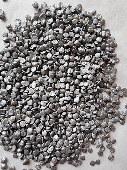 Pearlized silver sequin-shaped edible sprinkles for decorating cakes, cupcakes, cookies, chocolates, and special occasion desserts.
