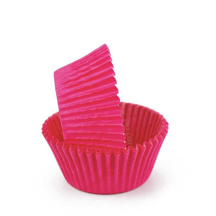 Pink glassine standard-size cupcake baking cups with greaseproof design, available in packs of 50 or 500.