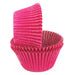 Stack of pink cupcake liners on a white background