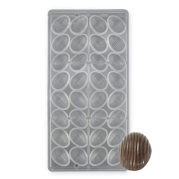 Polycarbonate chocolate mold with 32 ridged almond-shaped cavities for creating artisan chocolates, truffles, pralines, and candy pieces.
