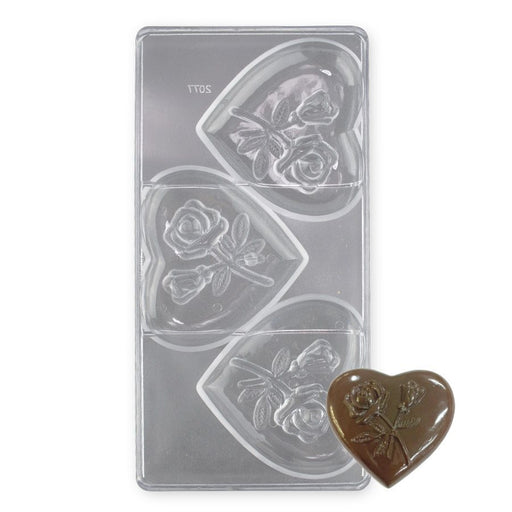Polycarbonate chocolate mold with 3 large heart-shaped cavities featuring rose designs for Valentine's Day chocolates and gourmet gifts.