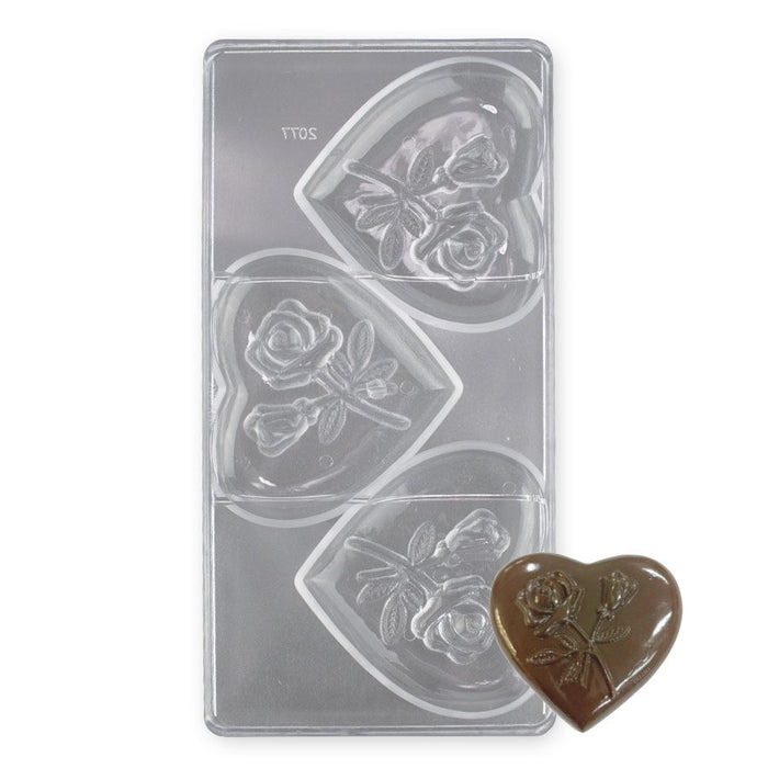 Polycarbonate chocolate mold with 3 large heart-shaped cavities featuring rose designs for Valentine's Day chocolates and gourmet gifts.