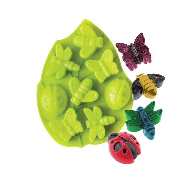Green silicone baking mold with butterfly, ladybug, bee, and dragonfly designs for decorative desserts and chocolates