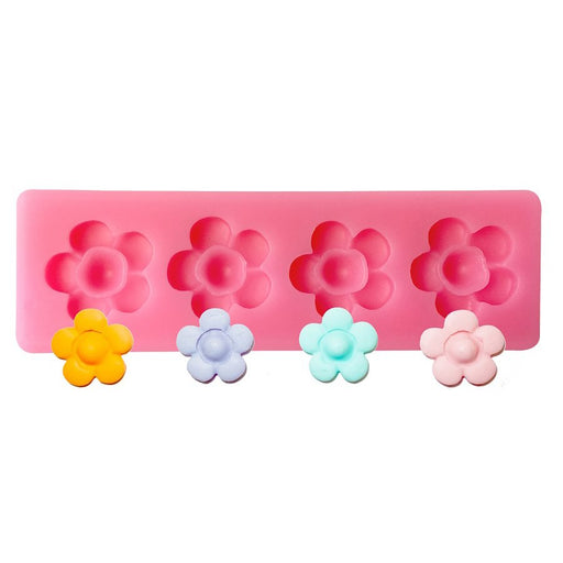 Pink daisy flower silicone fondant mold with 4 cavities for cake decorating, cupcakes, chocolates, cookies, and edible floral decorations.