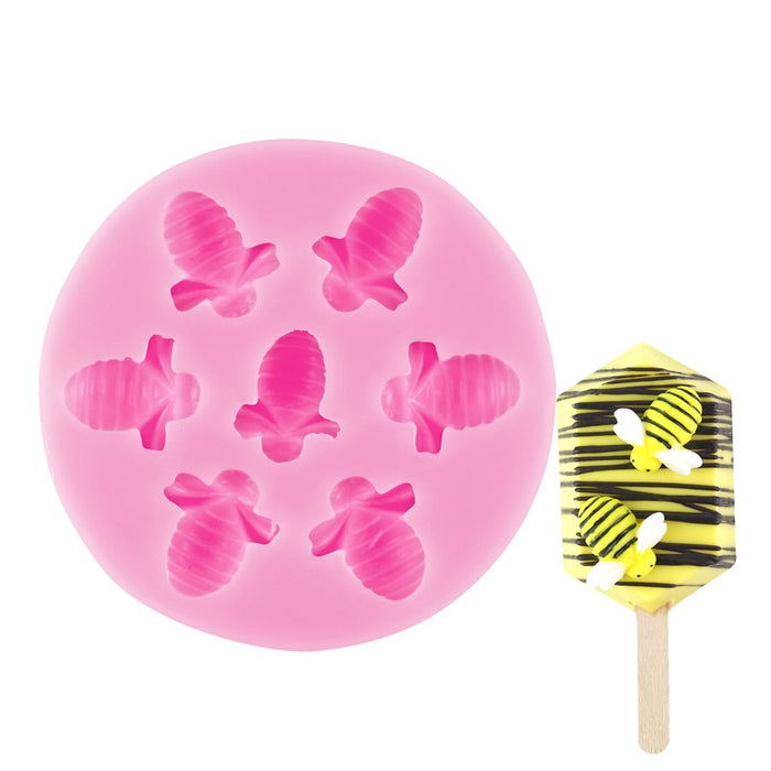 Pink honeybee silicone mold with 7 detailed bee cavities for fondant, chocolates, candy making, cupcake toppers, and cake decorating by NY Cake®