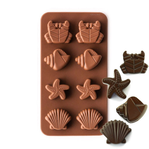 8-cavity silicone chocolate mold with seashell, starfish and crab shapes for ocean-themed chocolates, candies and dessert decorations.