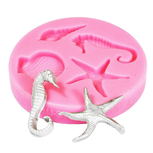 Pink seaside silicone fondant mold featuring seahorse, starfish, and ocean-themed designs for cake decorating, fondant accents, chocolate, and dessert decorations.
