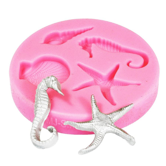 Pink seaside silicone fondant mold featuring seahorse, starfish, and ocean-themed designs for cake decorating, fondant accents, chocolate, and dessert decorations.
