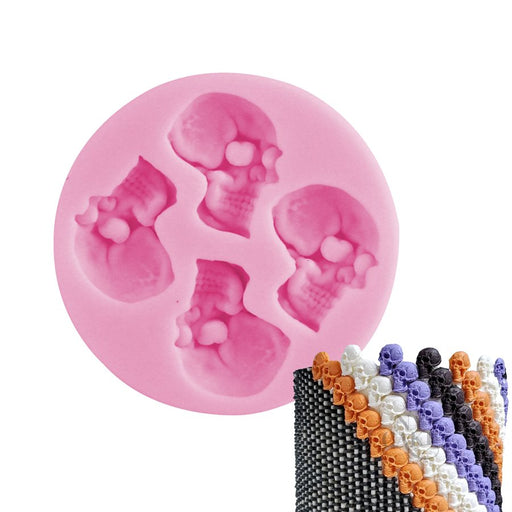 Pink 4-cavity skull silicone mold for making Halloween chocolate, fondant, candy and cake decorations.