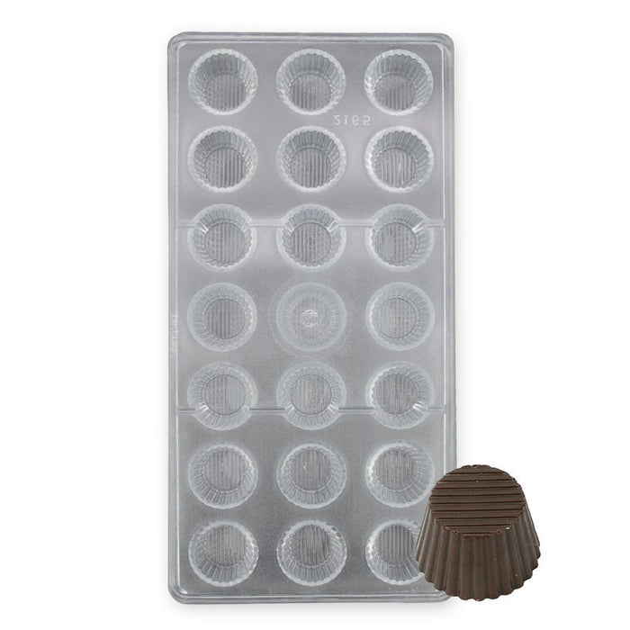 Polycarbonate chocolate mold with 21 small fluted round cavities for creating peanut butter cup-style chocolates, truffles, and gourmet confections.