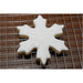 Decorated snowflake cookie made with reusable Christmas stencil