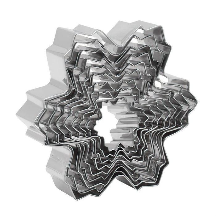 Set of 9 stainless steel snowflake cookie cutters in assorted sizes from 1 1/2 to 4 3/4 inches for Christmas baking.
