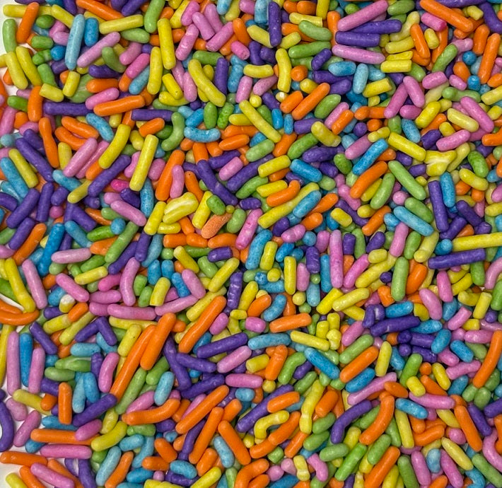 Colorful Spring Blend Jimmies sprinkles featuring pastel and bright rod-shaped decorations for cakes, cupcakes, cookies, and desserts.