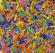 Colorful Spring Blend Jimmies sprinkles featuring pastel and bright rod-shaped decorations for cakes, cupcakes, cookies, and desserts.