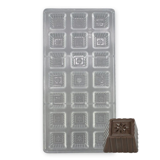 Polycarbonate chocolate mold with 21 square cavities featuring an embossed daisy flower design for creating glossy chocolates, bon bons, and truffles.