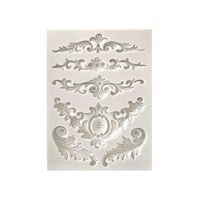 Reusable silicone mold with detailed swag scroll and ornamental fondant border cavities