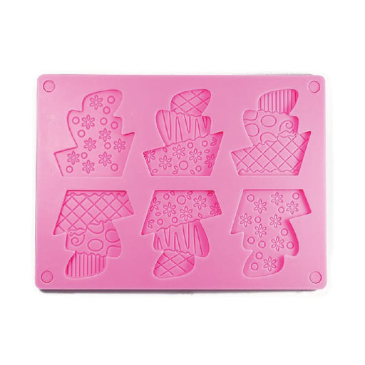 Two-piece silicone mold featuring topsy turvy cake designs for making detailed chocolates, fondant decorations, candy, and cake toppers.