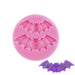 Pink silicone fondant mold with two vampire bat cavities for Halloween cake and cupcake decorations.