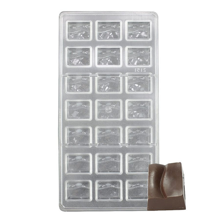 Polycarbonate chocolate mold with 21 wave-pattern cavities for creating smooth, glossy bon bons, truffles, and artisan chocolates.