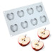 Silicone baking mold with apple-shaped cavities